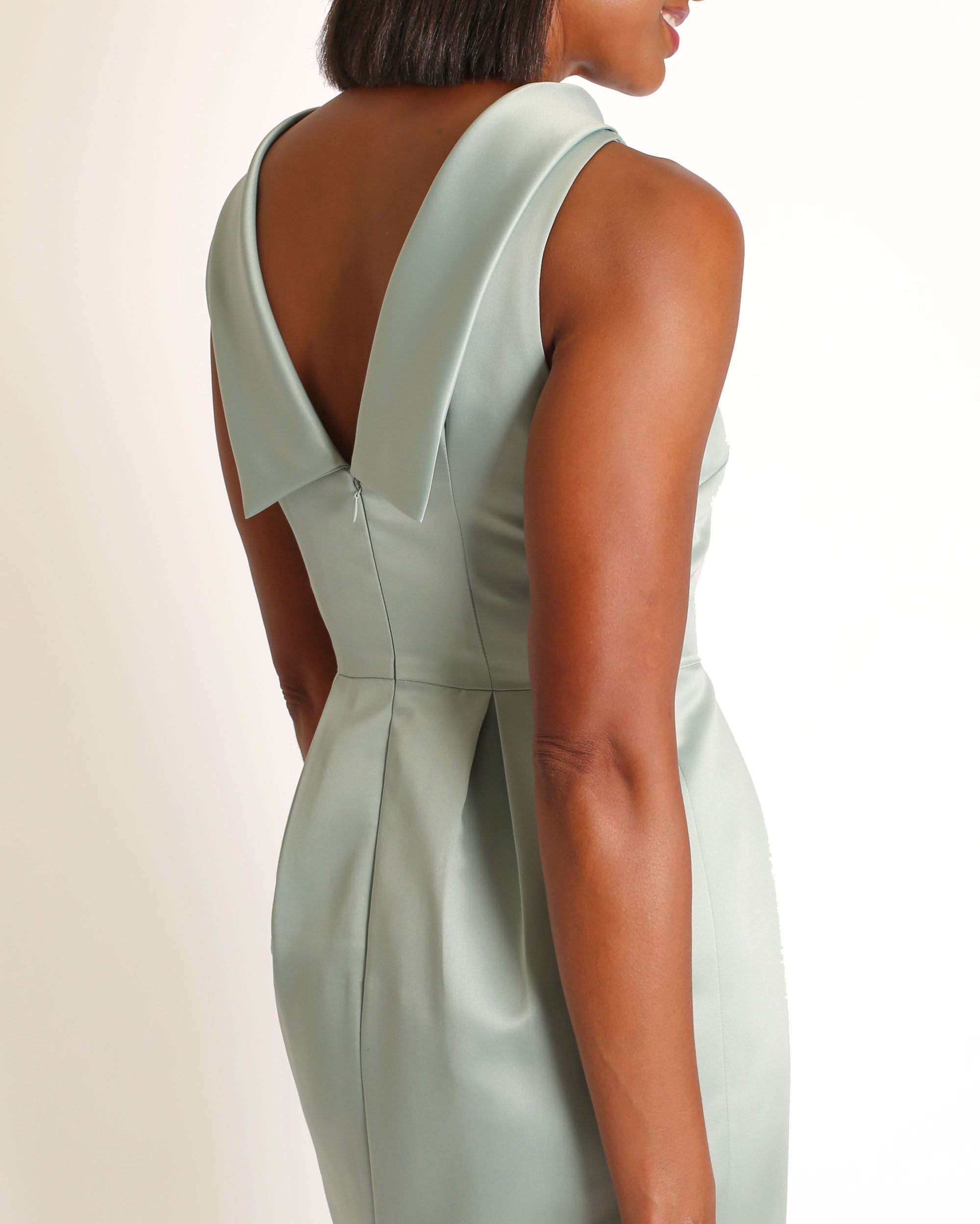 A floor-length sleeveless Eucalyptus Satin gown with a rolled collar neckline and a V-back detail.