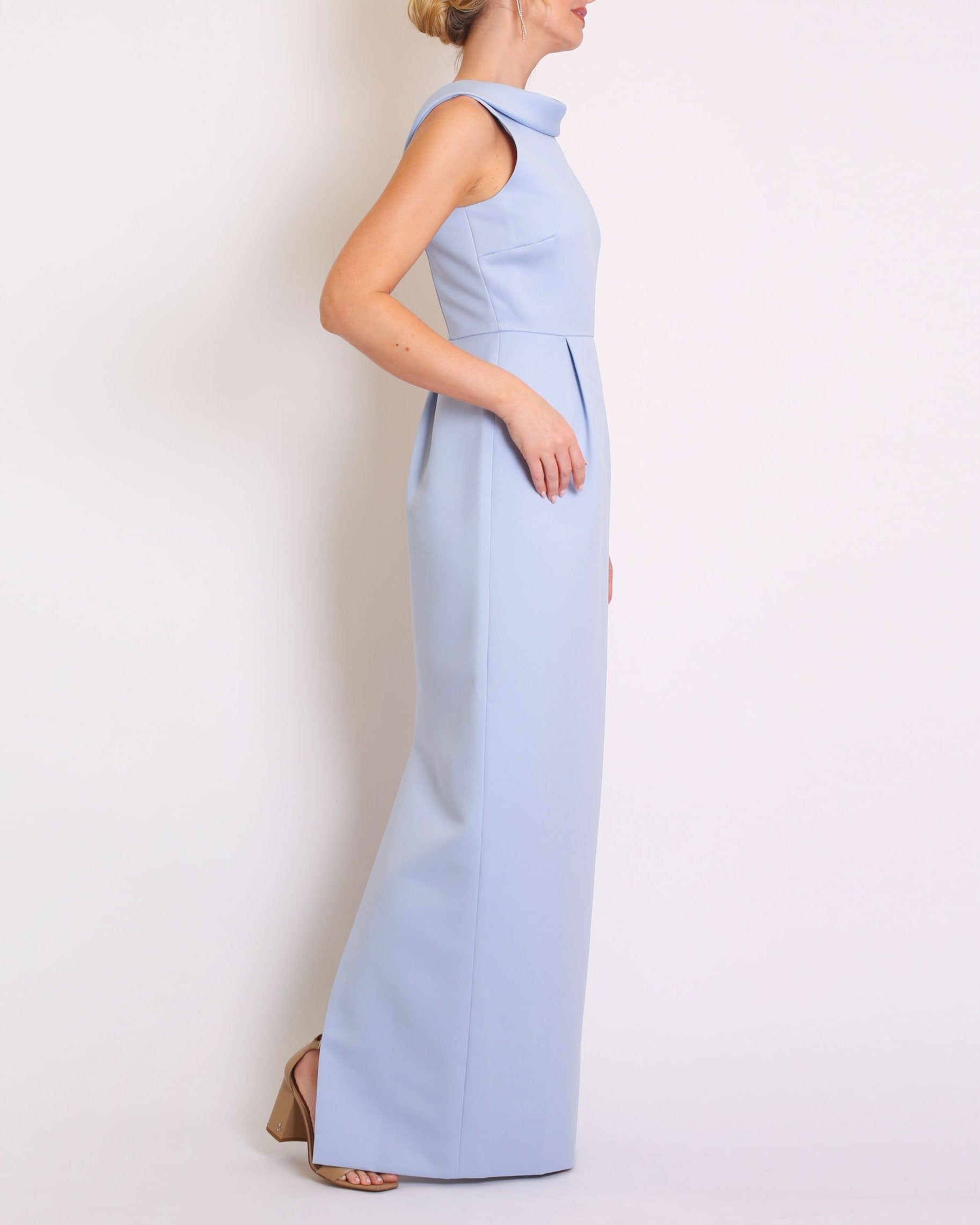 A floor-length sleeveless Light Blue Matte Satin gown with a rolled collar neckline and a V-back detail.