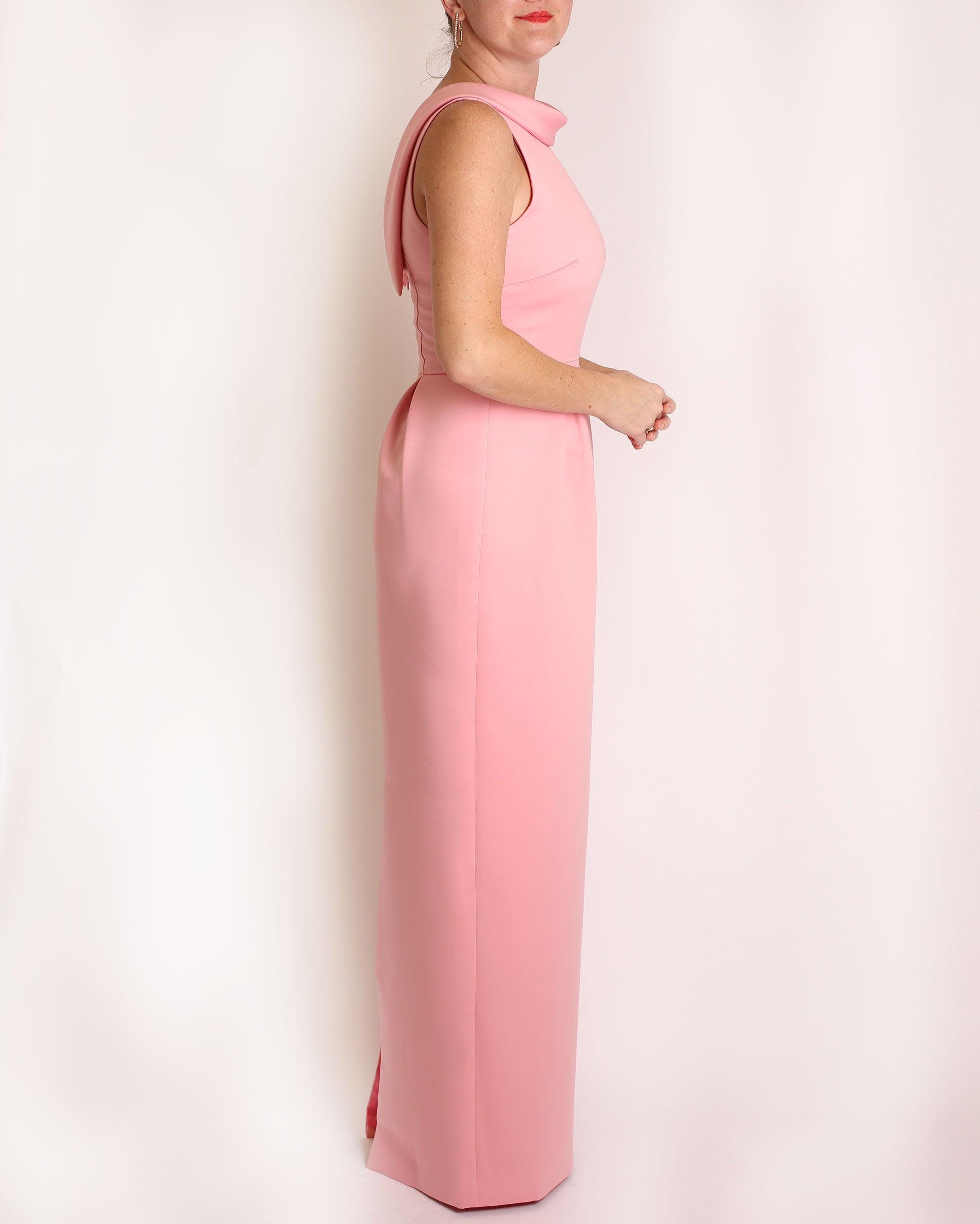 A floor-length sleeveless Pink Matte Satin gown with a rolled collar neckline and a V-back detail.