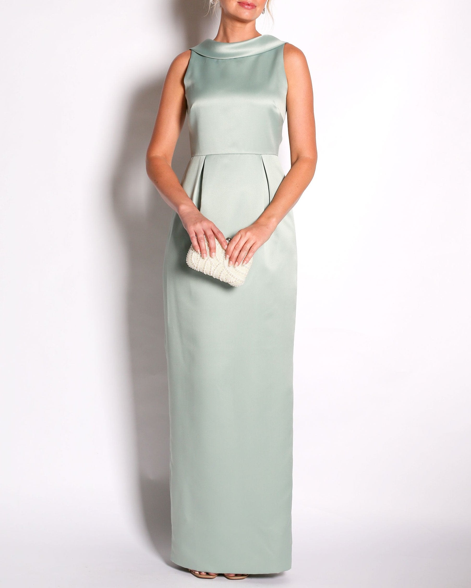 A floor-length sleeveless Eucalyptus Satin gown with a rolled collar neckline and a V-back detail.