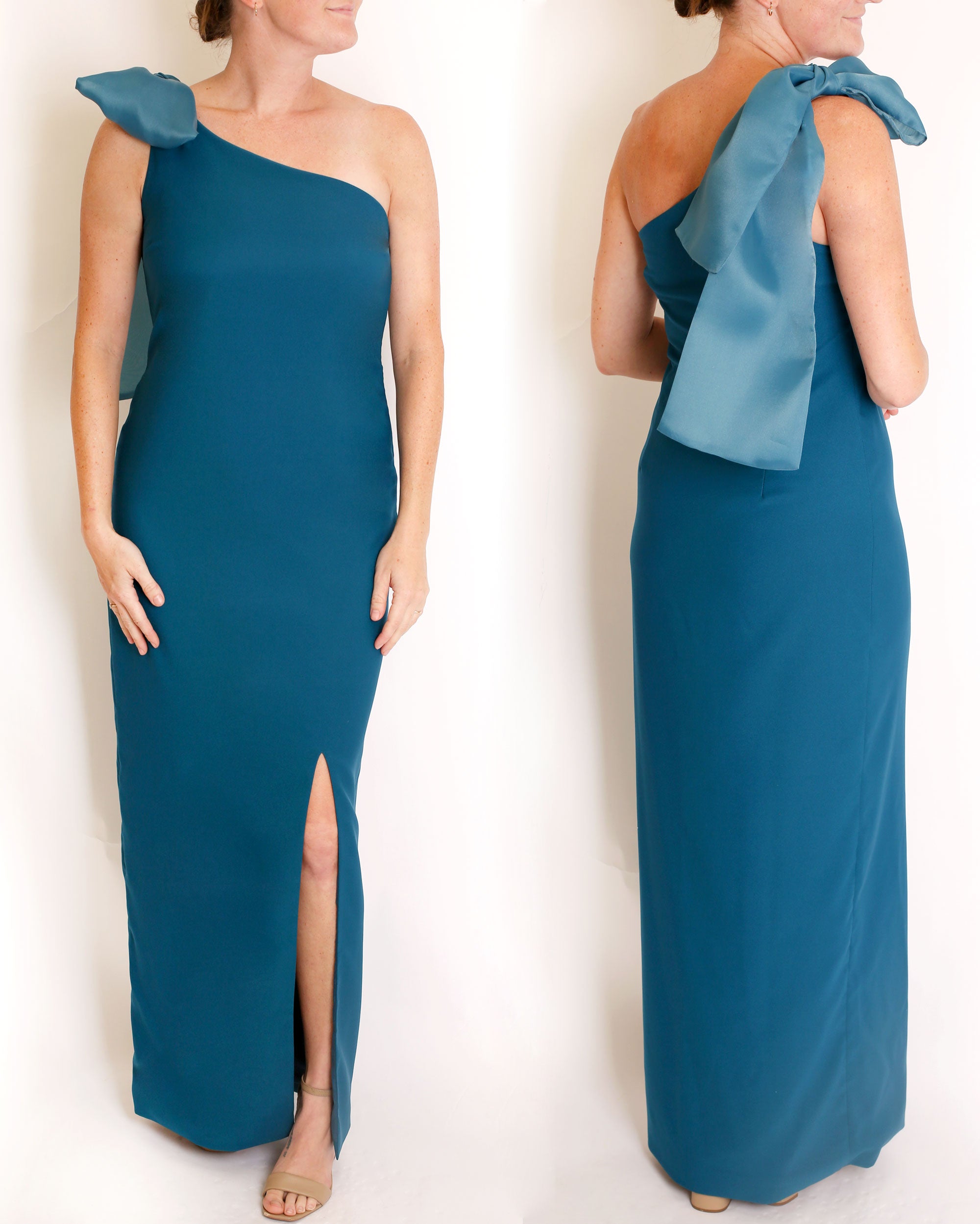 TEal one-shoulder gown with a large bow detail on a white background