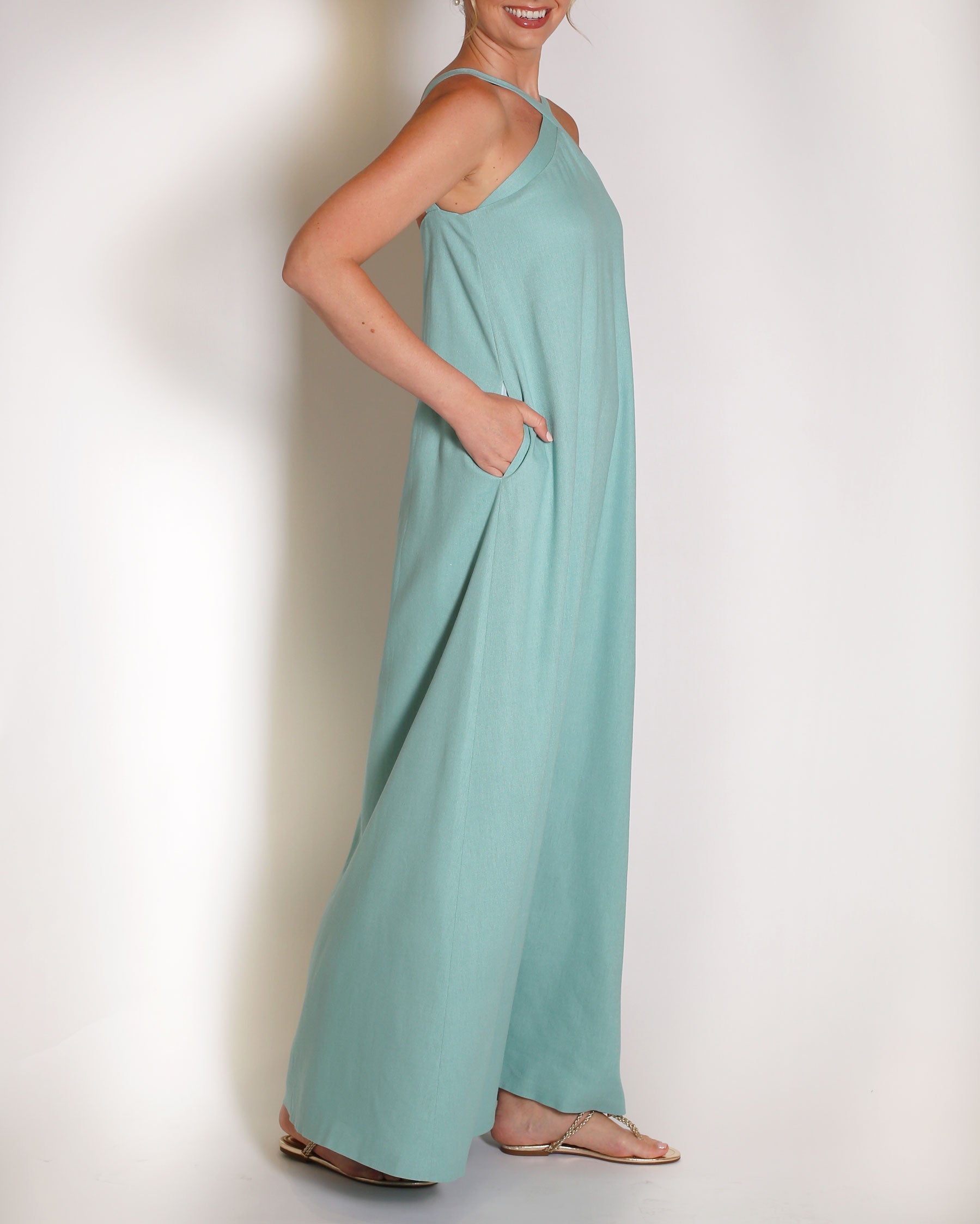 Aqua Blue linen gown halter style with x on the neckline.