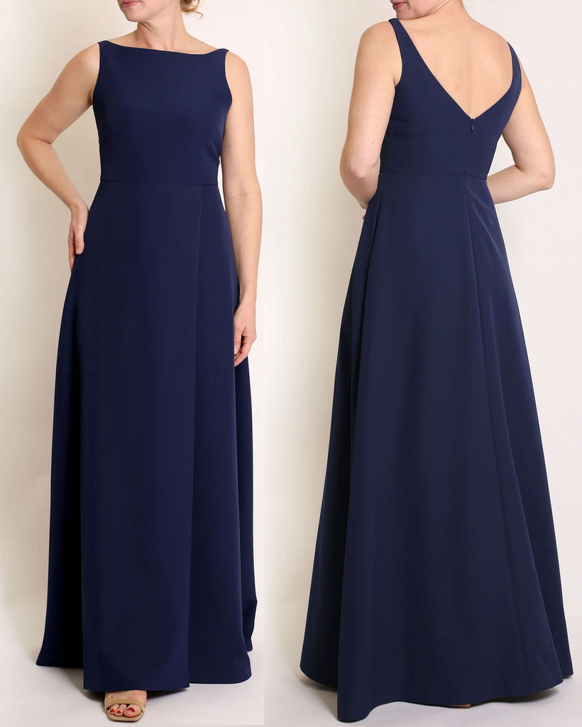 Navy Blue floor length evening gown with boat neck detail and v-back. A-line flared skirt with front side slit and pockets.