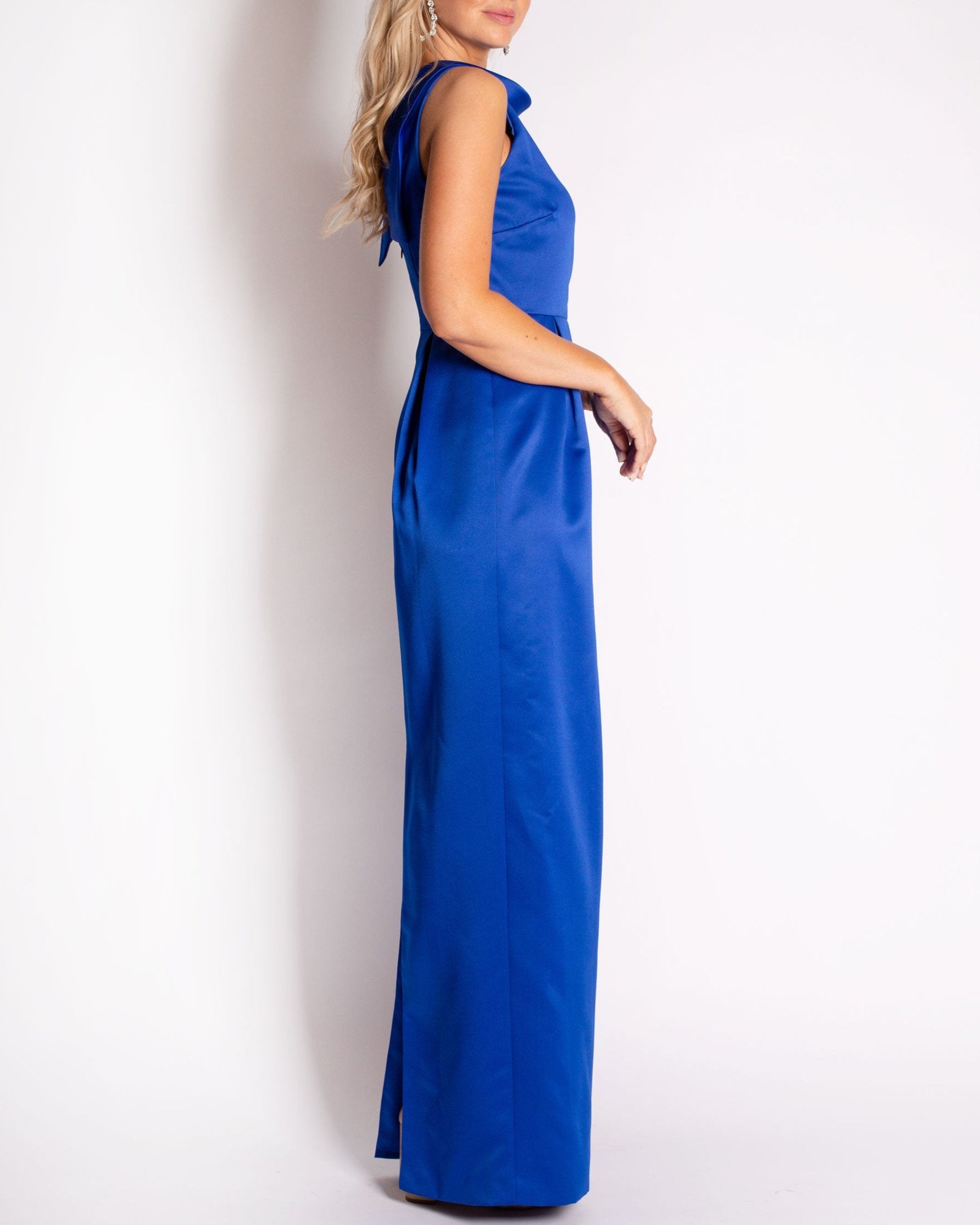 A floor-length sleeveless Royal Blue Cobalt Satin gown with a rolled collar neckline and a V-back detail.